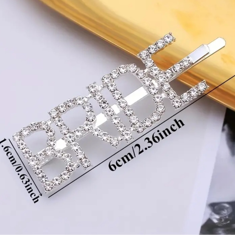 “Bride” hairpin (Barrett), rhinestones on silver Barrett. NIP,  2.3”x.6” approx
